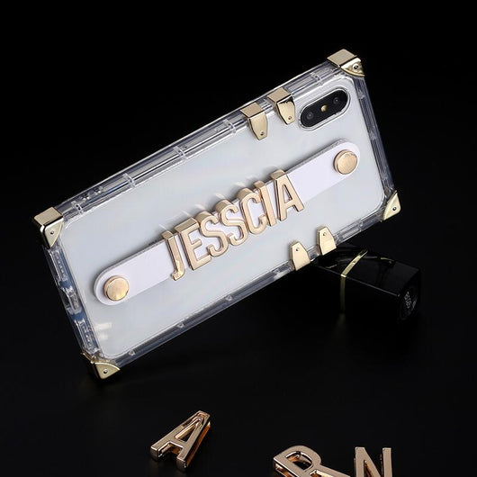 Translucent Trunk Case with White Leather Holding Strap and Gold Coloured Metal Personalisation