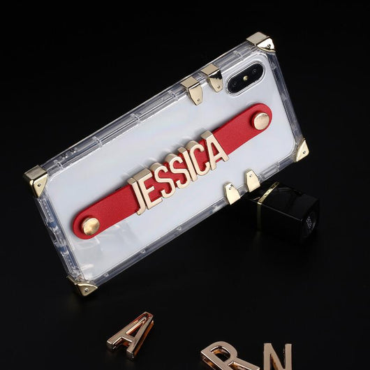 Translucent Trunk Case with Red Leather Holding Strap and Gold Coloured Metal Personalisation
